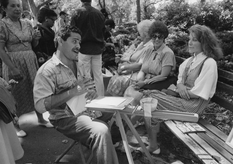 Manny Vega drawing people in the park in the 1980s.